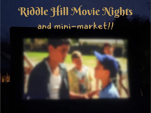 Outdoor movie screen at Riddle Hill Homestead during a free summer movie night and mini market in Grafton, New Hampshire.