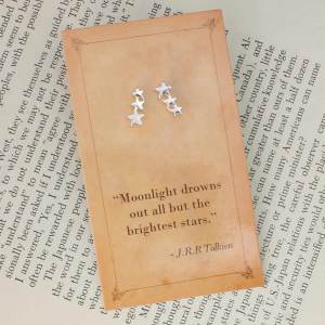 Silver-tone star stud earrings on a J.R.R. Tolkien quotation card.